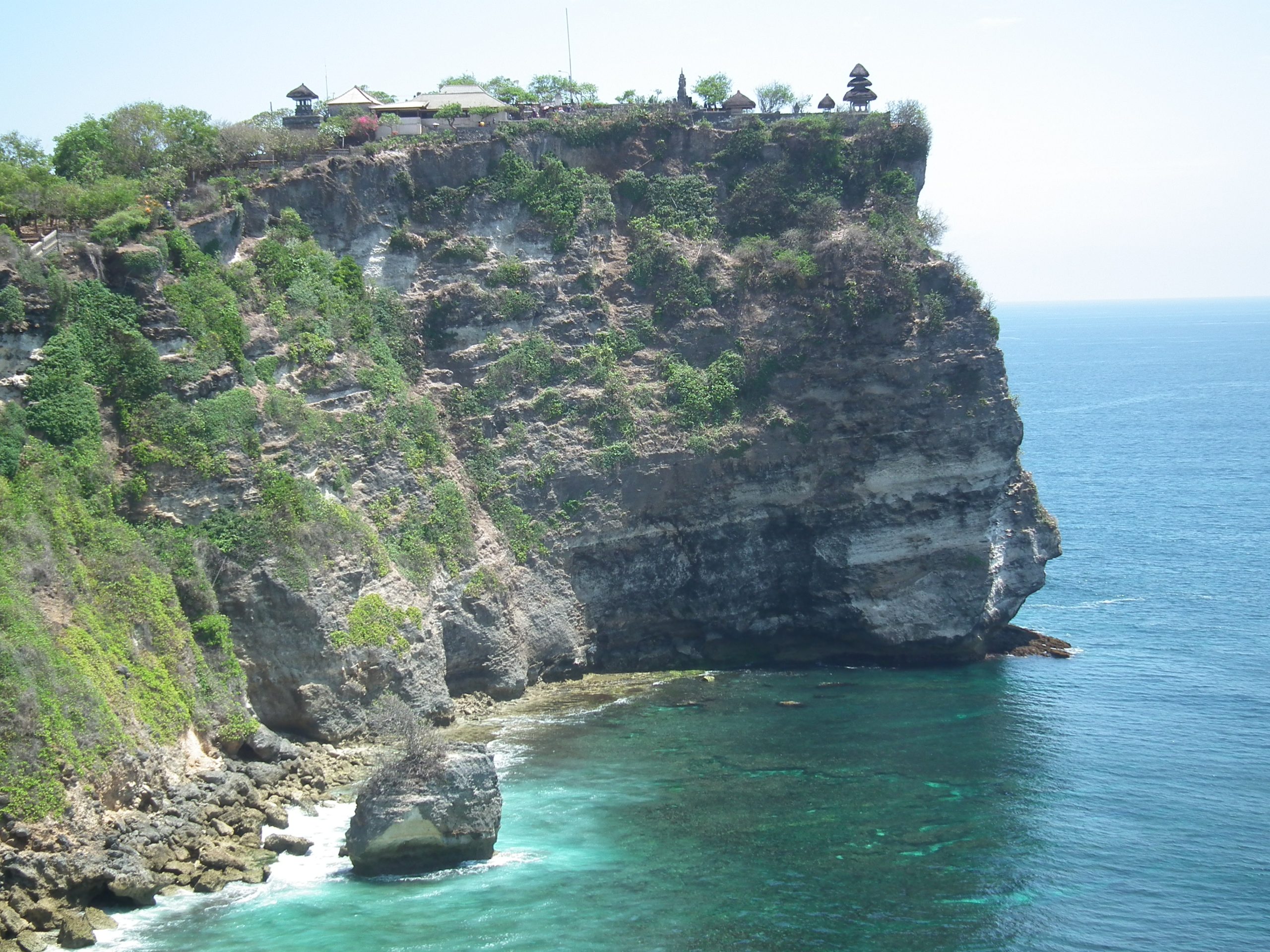 Bali travel guide photo of Uluwatu Temple perched on a cliff above the ocean