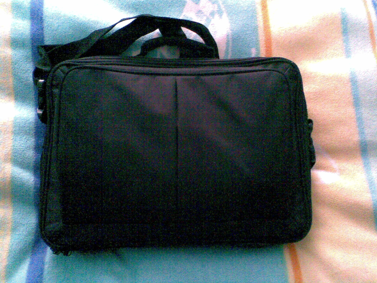 Laptop bag packed for a business trip carry-on
