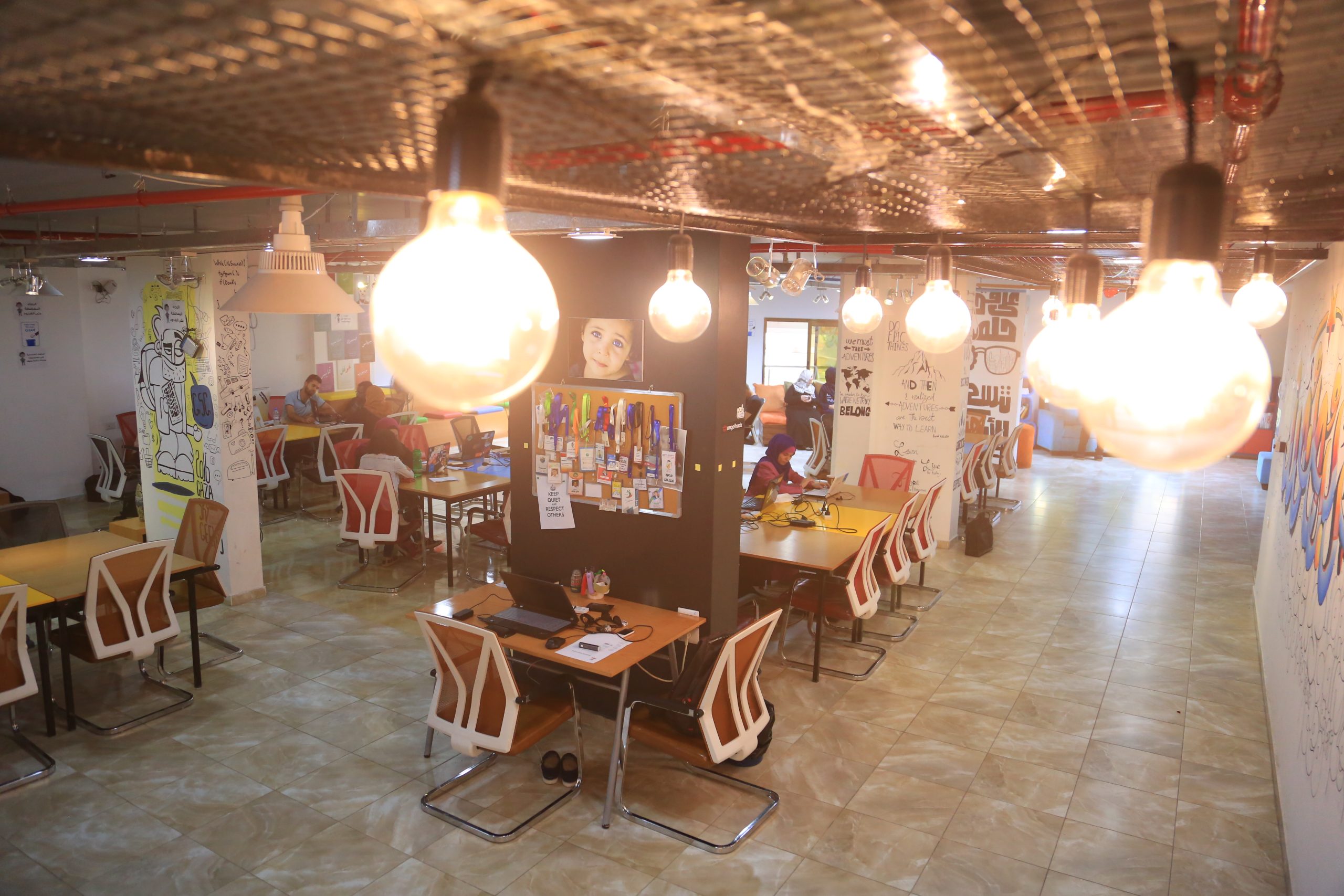 A shared coworking lounge typical of digital nomad hotels catering to remote workers