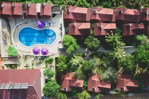 Top-down view of a resort pool, illustrating a hotel day pass staycation