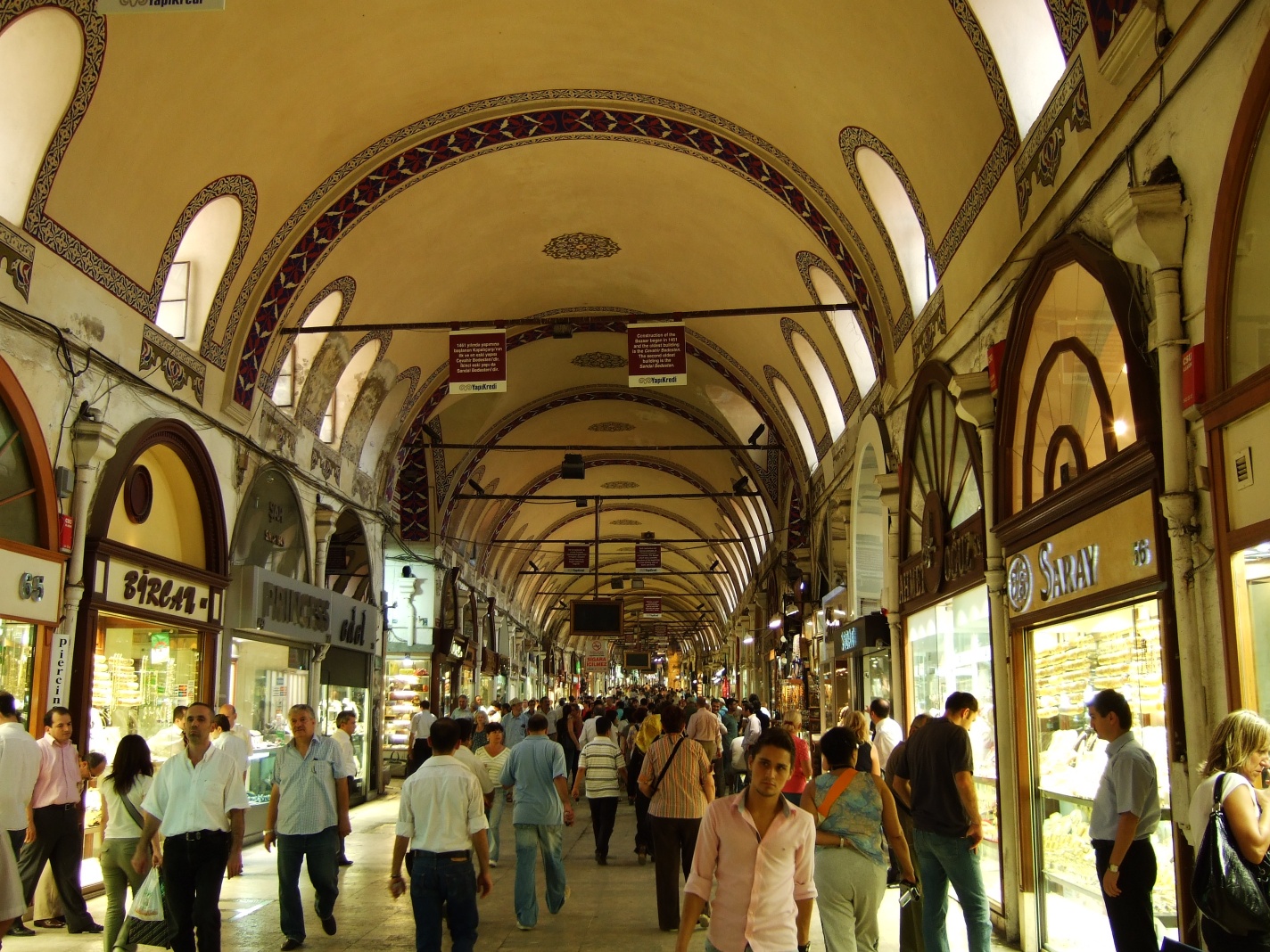 Covered market alley in Istanbul lined with shops near the food stalls of the Grand Bazaar