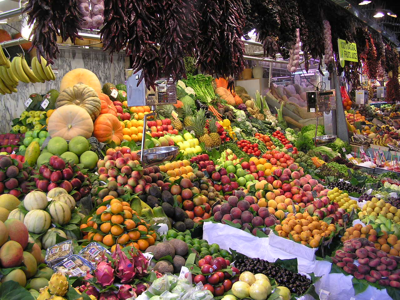 Fresh produce stalls at La Boqueria market, one of the best food cities in Europe for a culinary trip