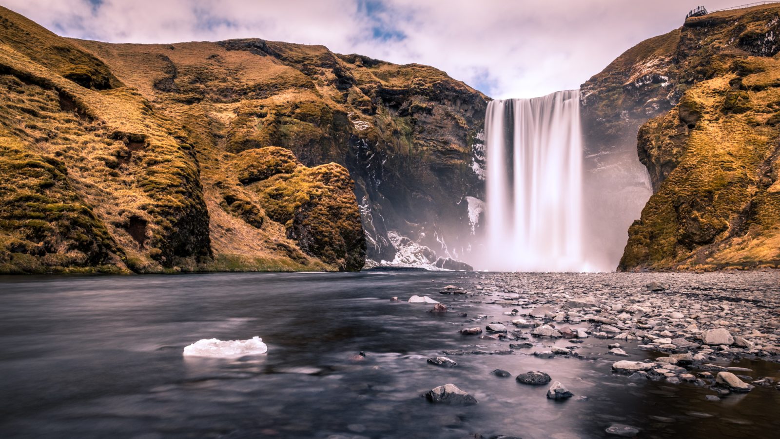 Skogafoss waterfall cascading over cliffs in Iceland