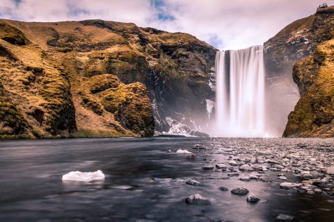 Skogafoss waterfall cascading over cliffs in Iceland